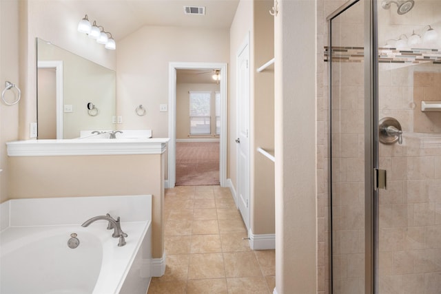 609 Racine Dr, Oak Point, TX 75068 - full bathroom featuring a stall shower, a garden tub, ceiling fan, tile patterned floors, and vanity