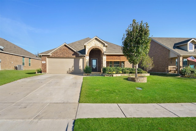 609 Racine Dr, Oak Point, TX 75068 - view of front of house with brick siding, cooling unit, a garage, concrete driveway, and a front yard