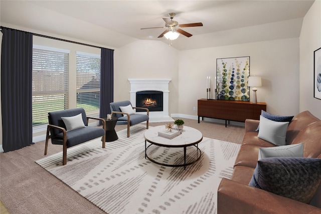 609 Racine Dr, Oak Point, TX 75068 - living room with a lit fireplace, light carpet, ceiling fan, and vaulted ceiling