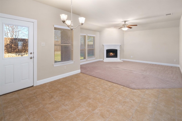609 Racine Dr, Oak Point, TX 75068 - unfurnished living room featuring light carpet, ceiling fan, baseboards, and a lit fireplace