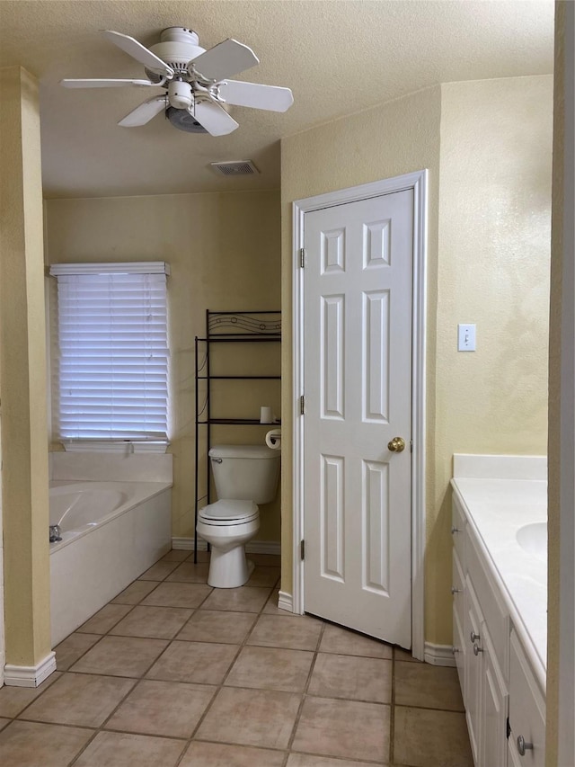 1102 N Main St, Leonard, TX 75452 - bathroom with ceiling fan, tile patterned floors, toilet, vanity, and a textured ceiling