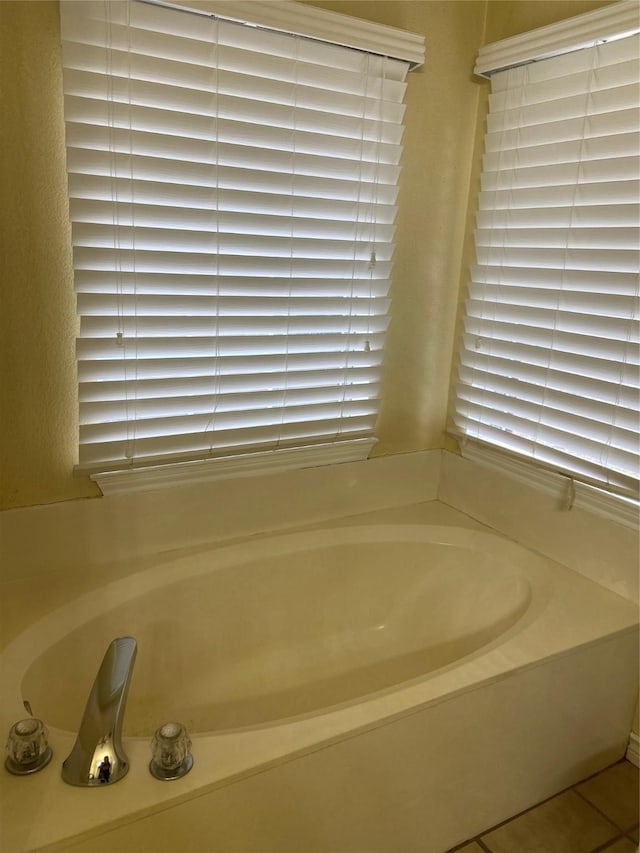 1102 N Main St, Leonard, TX 75452 - full bathroom featuring a garden tub and tile patterned floors