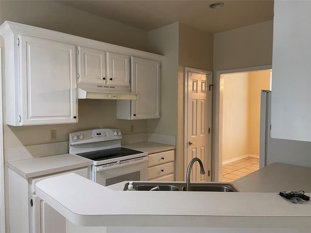 1102 N Main St, Leonard, TX 75452 - kitchen with white range with electric cooktop, under cabinet range hood, a sink, light countertops, and recessed lighting