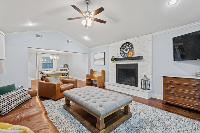 2306 Monte Cristo Dr, Sherman, TX 75092 - living area with ceiling fan, wood finished floors, a chandelier, a stone fireplace, and vaulted ceiling