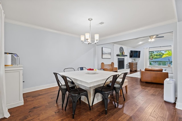 2306 Monte Cristo Dr, Sherman, TX 75092 - dining room with ornamental molding, a chandelier, dark wood finished floors, ceiling fan, and a large fireplace