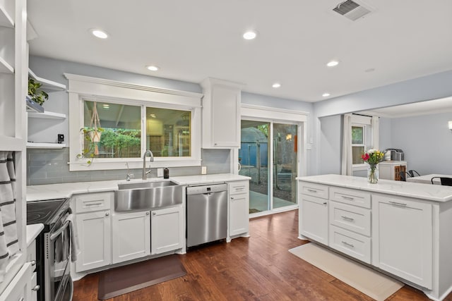 2306 Monte Cristo Dr, Sherman, TX 75092 - kitchen featuring appliances with stainless steel finishes, a sink, decorative backsplash, dark wood-type flooring, and recessed lighting