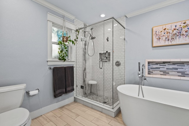 2306 Monte Cristo Dr, Sherman, TX 75092 - bathroom featuring crown molding, a shower stall, toilet, a freestanding bath, and baseboards
