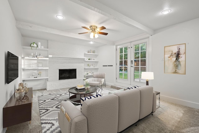 2306 Monte Cristo Dr, Sherman, TX 75092 - living area featuring baseboards, beamed ceiling, french doors, ceiling fan, and a fireplace