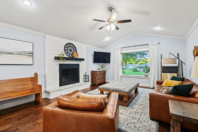 2306 Monte Cristo Dr, Sherman, TX 75092 - living area featuring dark wood-type flooring, a ceiling fan, a fireplace, lofted ceiling, and ornamental molding