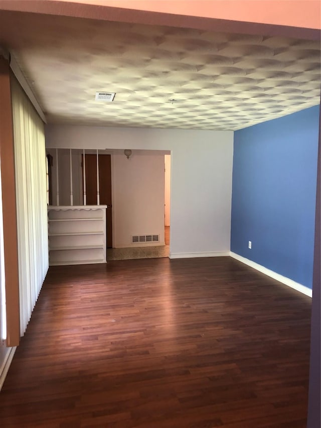 608 Spinner Rd, Desoto, TX 75115 - unfurnished room featuring baseboards and dark wood-style floors
