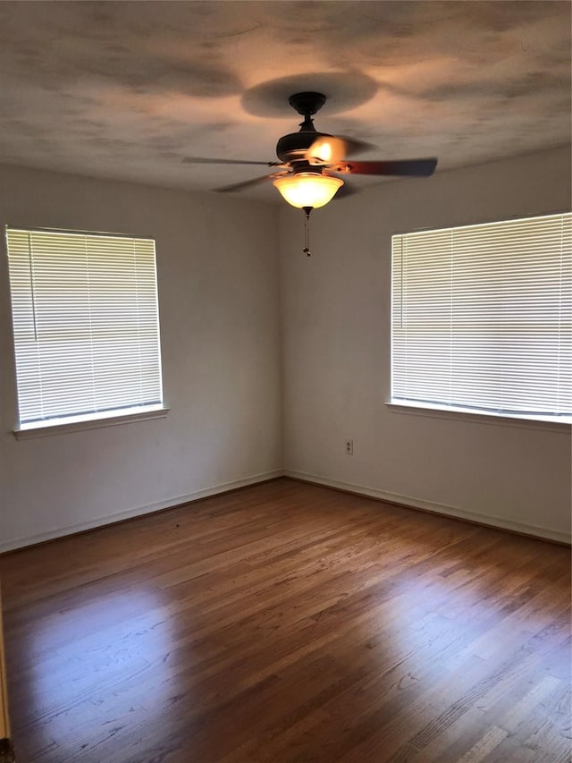 608 Spinner Rd, Desoto, TX 75115 - empty room with wood finished floors, ceiling fan, and baseboards