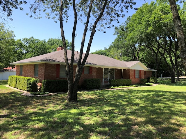 608 Spinner Rd, Desoto, TX 75115 - ranch-style home featuring brick siding, a front lawn, and a chimney