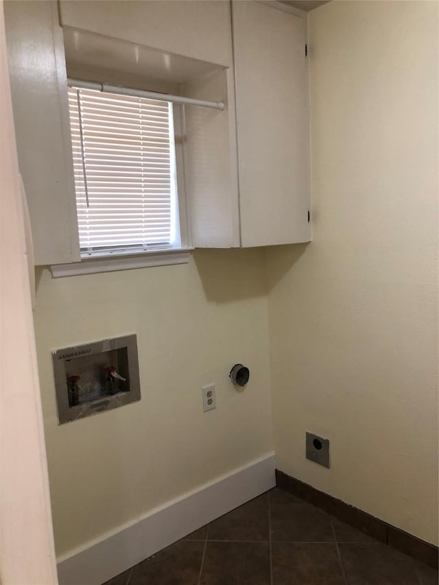 608 Spinner Rd, Desoto, TX 75115 - washroom featuring electric dryer hookup, cabinet space, washer hookup, baseboards, and dark tile patterned floors