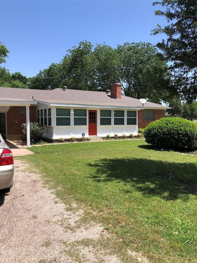 608 Spinner Rd, Desoto, TX 75115 - single story home with brick siding, a front yard, and a chimney