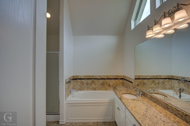 122 Lola Cir, Benton, LA 71006 - bathroom featuring a shower stall, a garden tub, tile patterned flooring, vanity, and a high ceiling