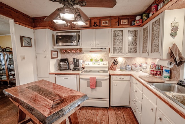 12815 N Fm 219, Dublin, TX 76446 - kitchen featuring white appliances, under cabinet range hood, light countertops, and wood finished floors