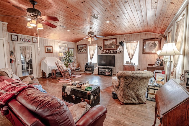 12815 N Fm 219, Dublin, TX 76446 - living room with lofted ceiling, a ceiling fan, wood ceiling, wood walls, and wood finished floors