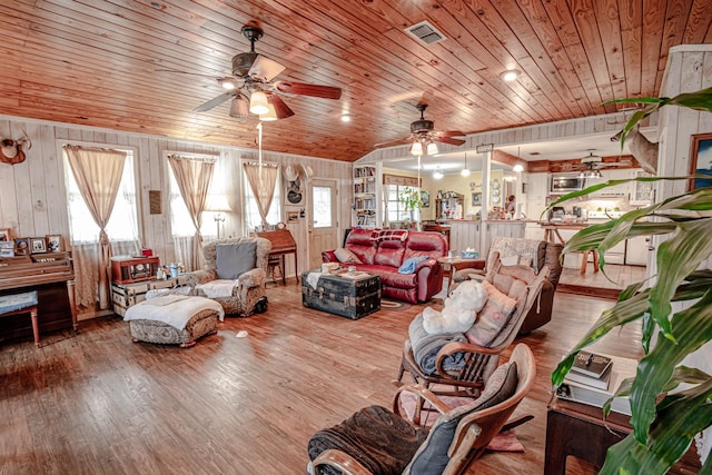 12815 N Fm 219, Dublin, TX 76446 - living room with a ceiling fan, wood ceiling, wood finished floors, and wood walls
