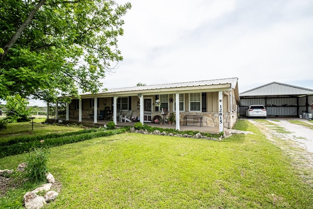 12815 N Fm 219, Dublin, TX 76446 - view of front of property with driveway, a front lawn, a porch, and a carport