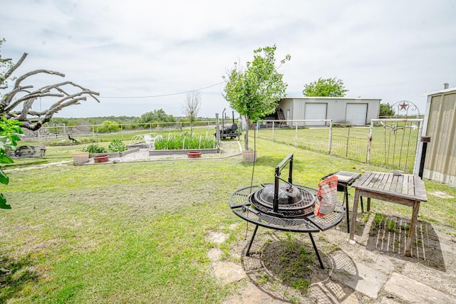 12815 N Fm 219, Dublin, TX 76446 - view of yard featuring a fire pit and a garden