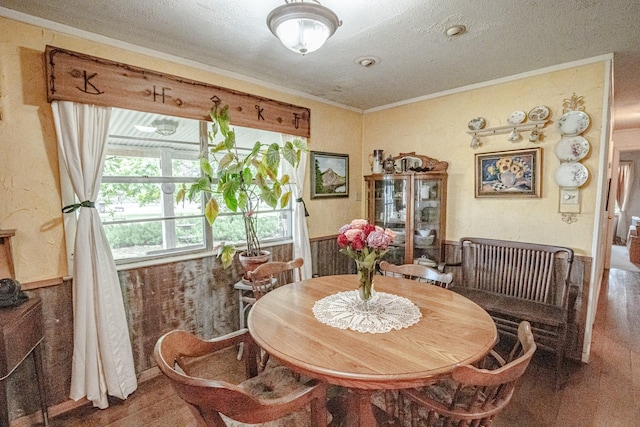 12815 N Fm 219, Dublin, TX 76446 - dining room featuring a textured ceiling, crown molding, and wood finished floors