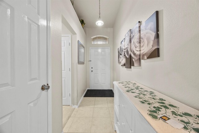 doorway featuring light tile patterned floors