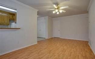 3233 S Univer Dr, Fort Worth, TX 76109 - spare room featuring wood finished floors, a ceiling fan, and baseboards