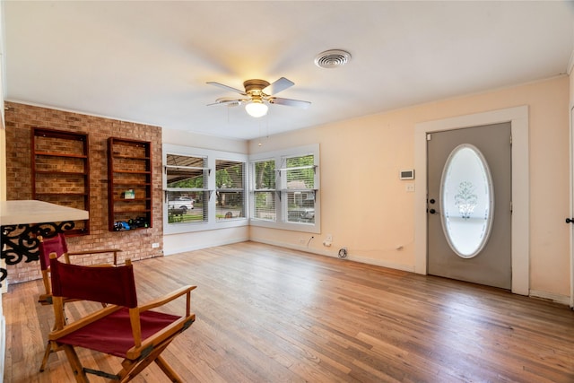 670 SE 22nd St SE, Paris, TX 75460 - foyer with ceiling fan, light wood-type flooring, and baseboards