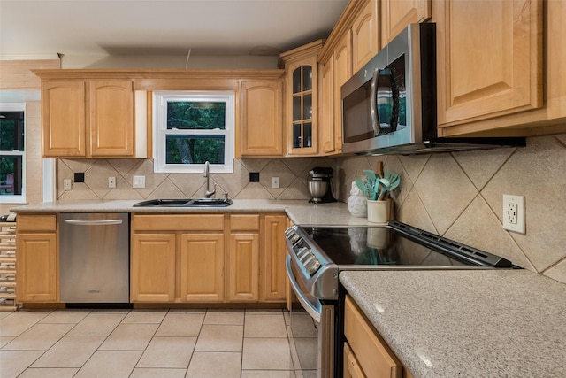 2012 S Meadow Way Cir, Arlington, TX 76015 - kitchen with stainless steel appliances, a sink, light countertops, tasteful backsplash, and glass insert cabinets