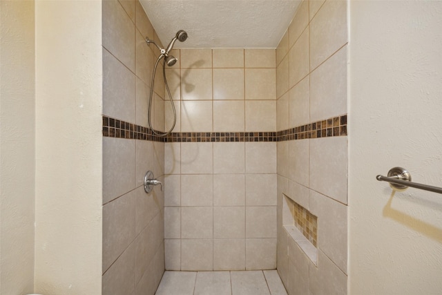 2302 Denmark Dr, Garland, TX 75040 - full bath featuring tiled shower and a textured ceiling