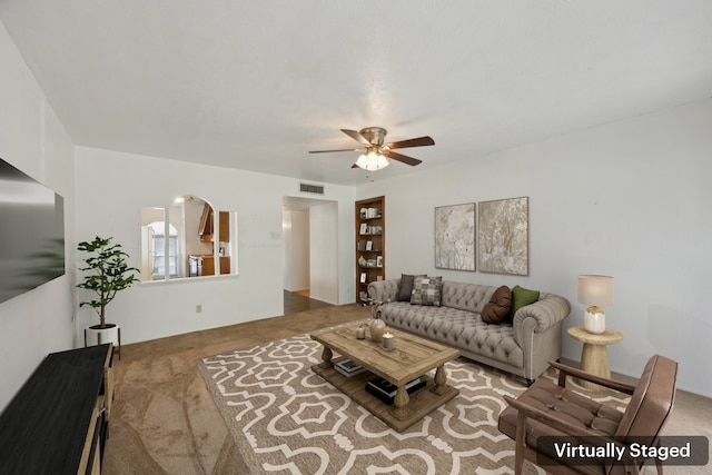 2302 Denmark Dr, Garland, TX 75040 - living area with carpet flooring and ceiling fan