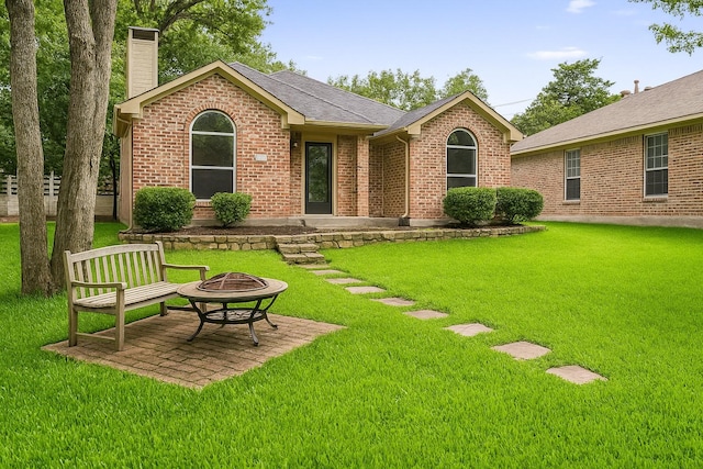 1219 Haines Ave, Dallas, TX 75208 - view of green lawn with an outdoor fire pit