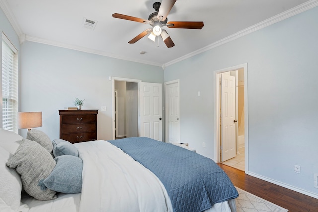 1219 Haines Ave, Dallas, TX 75208 - bedroom featuring wood finished floors, crown molding, ensuite bath, and ceiling fan
