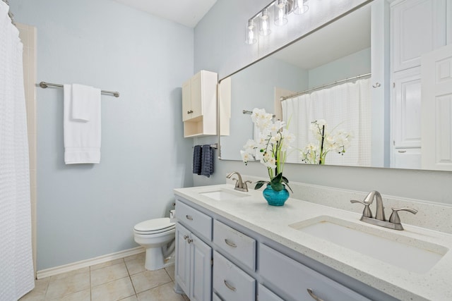 1219 Haines Ave, Dallas, TX 75208 - bathroom featuring double vanity, tile patterned flooring, and curtained shower