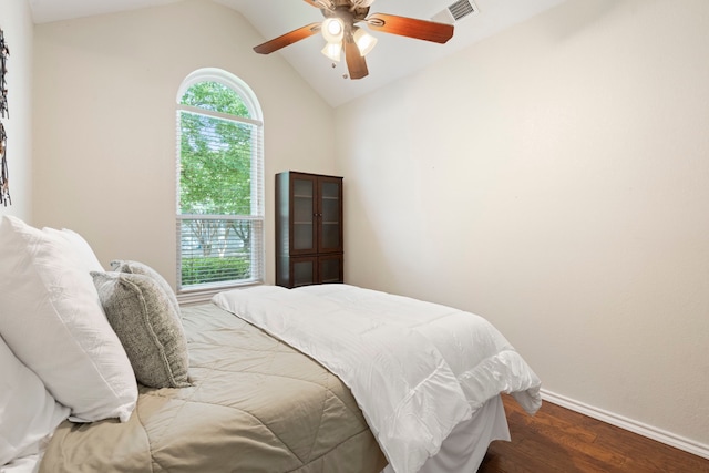 1219 Haines Ave, Dallas, TX 75208 - bedroom featuring multiple windows, wood finished floors, lofted ceiling, and a ceiling fan