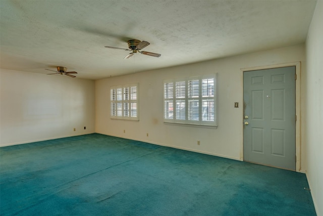 1406 E Cortez Dr, Wichita Falls, TX 76306 - spare room featuring a ceiling fan, a textured ceiling, carpet floors, and baseboards