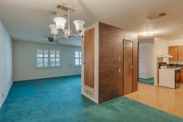 1406 E Cortez Dr, Wichita Falls, TX 76306 - unfurnished room featuring a chandelier, ceiling fan, and light colored carpet