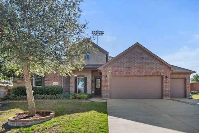 3626 Green Bluff Ct, Midlothian, TX 76065 - view of front of house with an attached garage, driveway, and brick siding