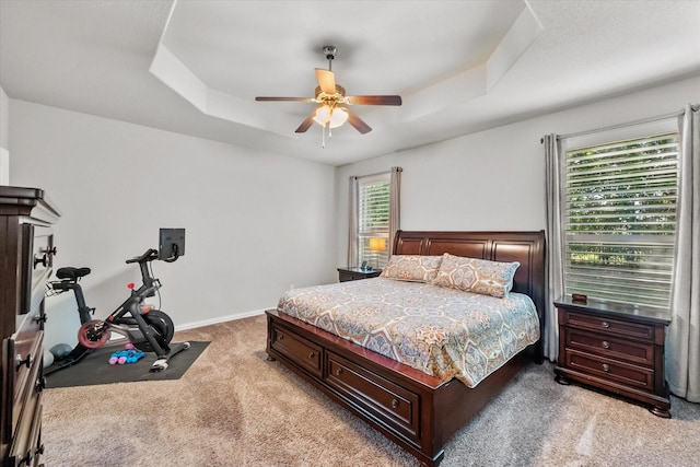 3626 Green Bluff Ct, Midlothian, TX 76065 - bedroom featuring light colored carpet, a tray ceiling, baseboards, and ceiling fan