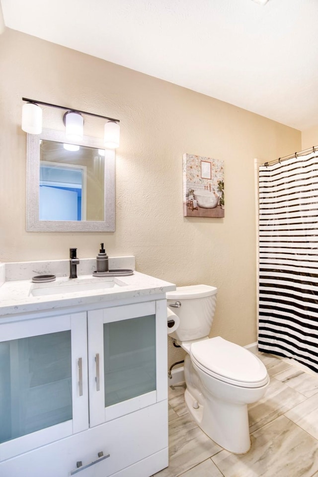 4626 Nervin St, The Colony, TX 75056 - bathroom featuring toilet, vanity, and a shower with curtain