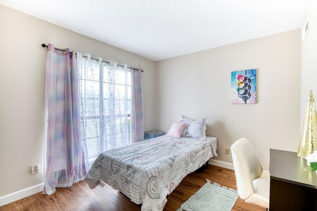 4626 Nervin St, The Colony, TX 75056 - bedroom with wood finished floors and baseboards