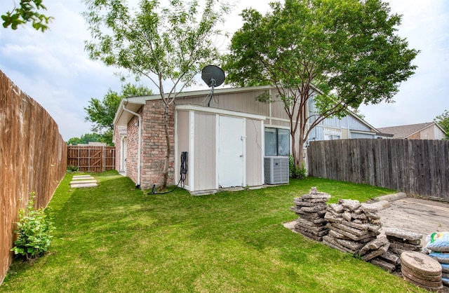 4626 Nervin St, The Colony, TX 75056 - view of yard featuring an outdoor structure, a storage unit, and central air condition unit
