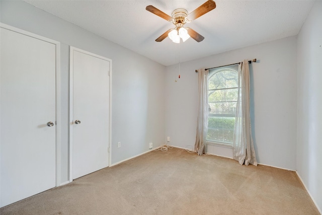 240 N Bryan Pl, Mesquite, TX 75149 - unfurnished bedroom with light carpet and ceiling fan