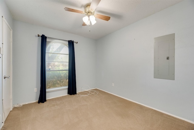 240 N Bryan Pl, Mesquite, TX 75149 - spare room featuring electric panel, light colored carpet, a ceiling fan, and baseboards