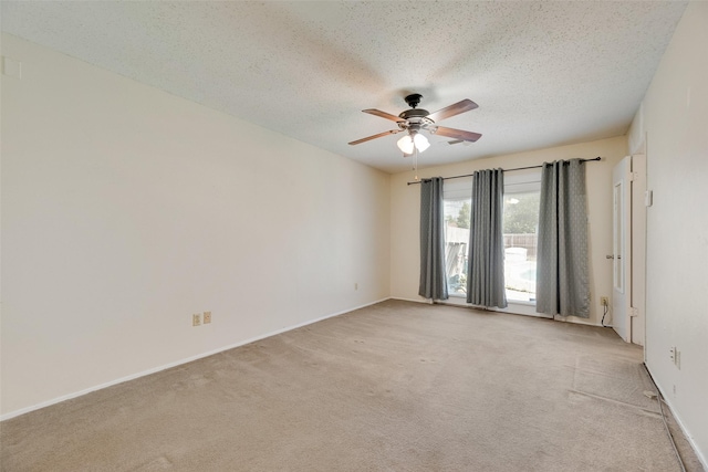 240 N Bryan Pl, Mesquite, TX 75149 - empty room featuring ceiling fan, light carpet, a textured ceiling, and baseboards