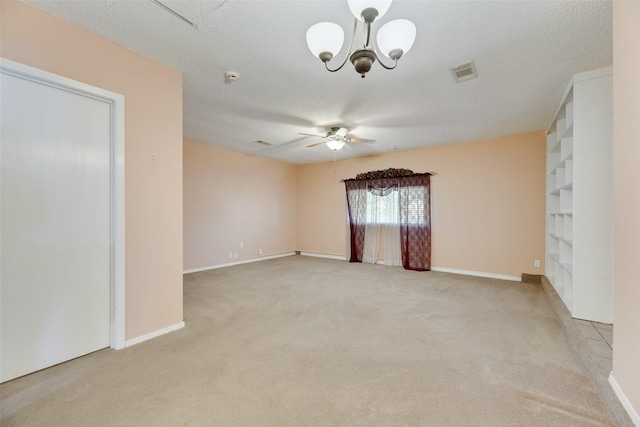 240 N Bryan Pl, Mesquite, TX 75149 - spare room with light colored carpet, a ceiling fan, a chandelier, a textured ceiling, and baseboards