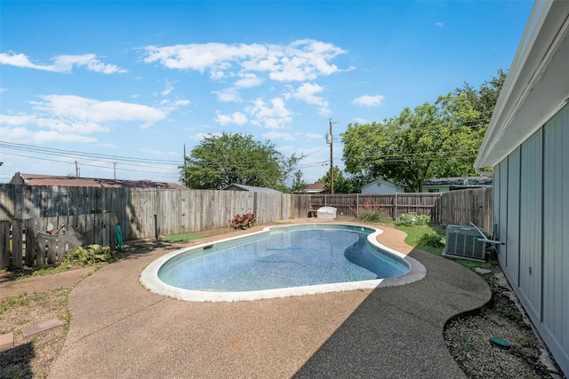 240 N Bryan Pl, Mesquite, TX 75149 - view of swimming pool featuring central AC unit, a fenced backyard, and a patio area