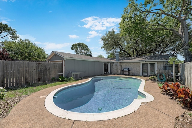 240 N Bryan Pl, Mesquite, TX 75149 - view of swimming pool featuring a fenced backyard and central air condition unit