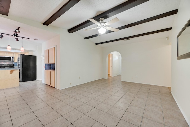 240 N Bryan Pl, Mesquite, TX 75149 - unfurnished living room with arched walkways, a ceiling fan, and light tile patterned floors