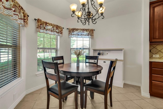 201 Villanova Dr, Van Alstyne, TX 75495 - dining space featuring a chandelier, light tile patterned floors, and baseboards